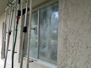 Accredited field testing agency using calibrated spray rack for window water penetration test