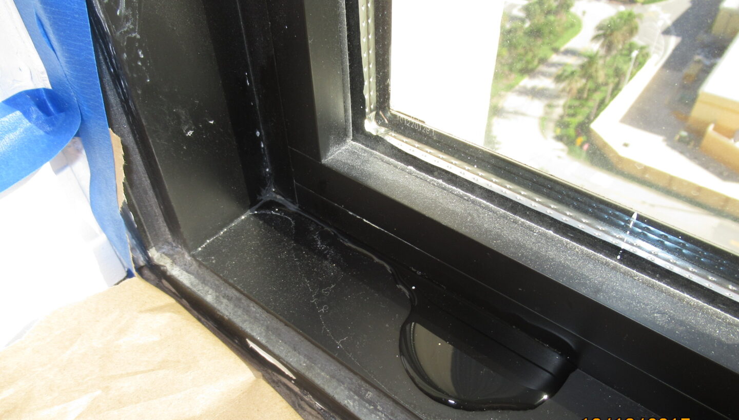 Water intrusion visible at an interior horizontal window mullion in a South Florida condominium high-rise.